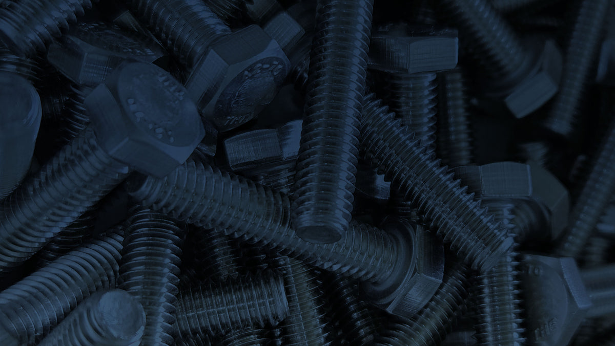 Close-up of blue screws and nuts on a dark background